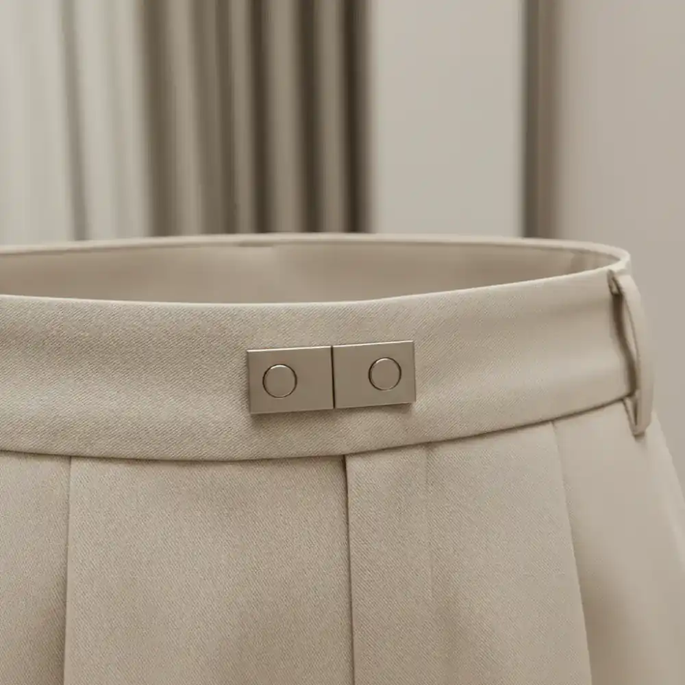 Close-up of a magnetic trouser closure seamlessly integrated into the waistband.
